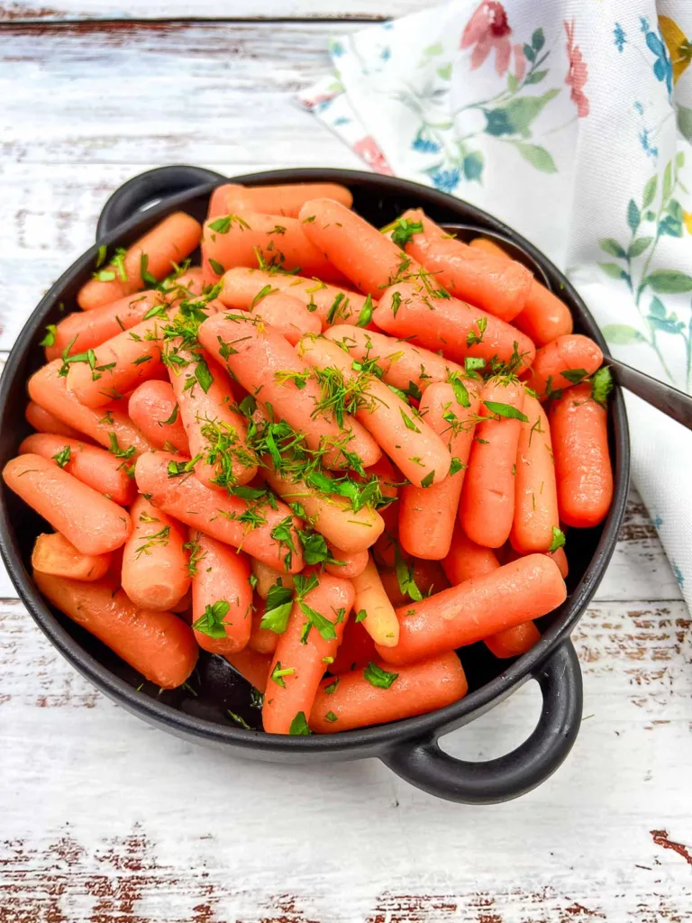 Cracker Barrel Baby Carrots in a black dish.