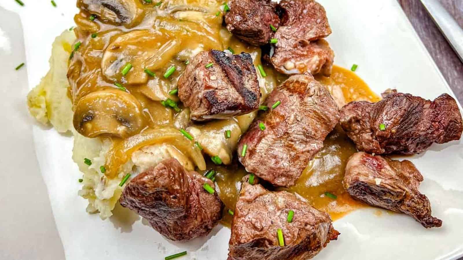 Texas Roadhouse Beef Tips on a white plate.