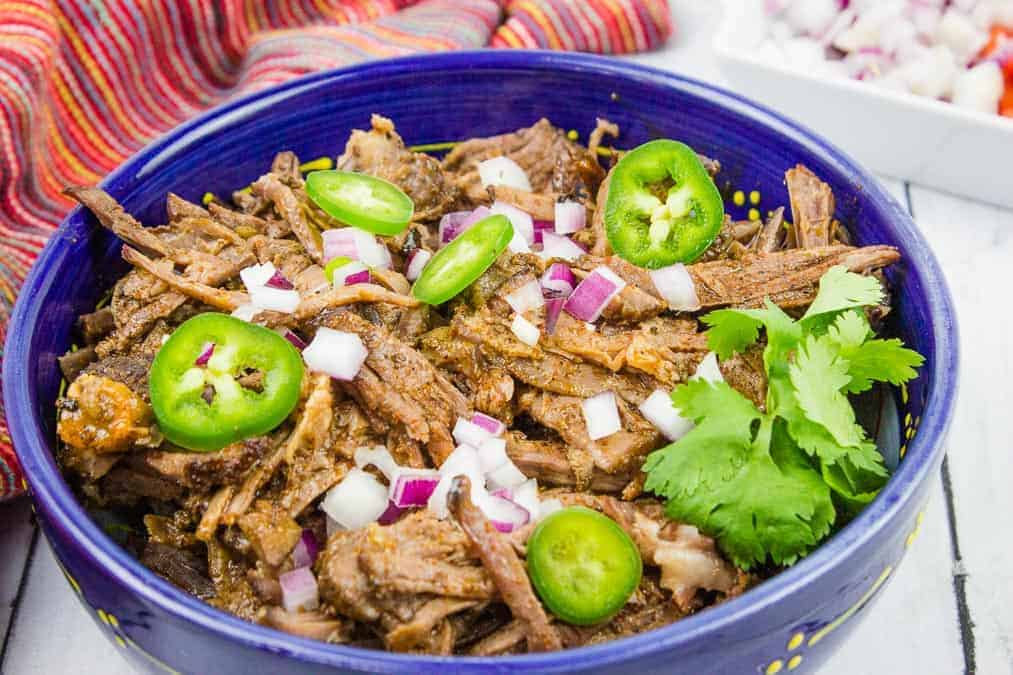 Beef Barbacoa in a blue bowl.