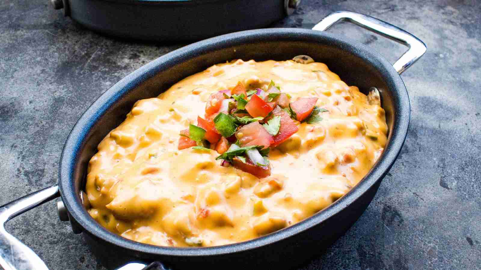 Smoked queso in a black pot.