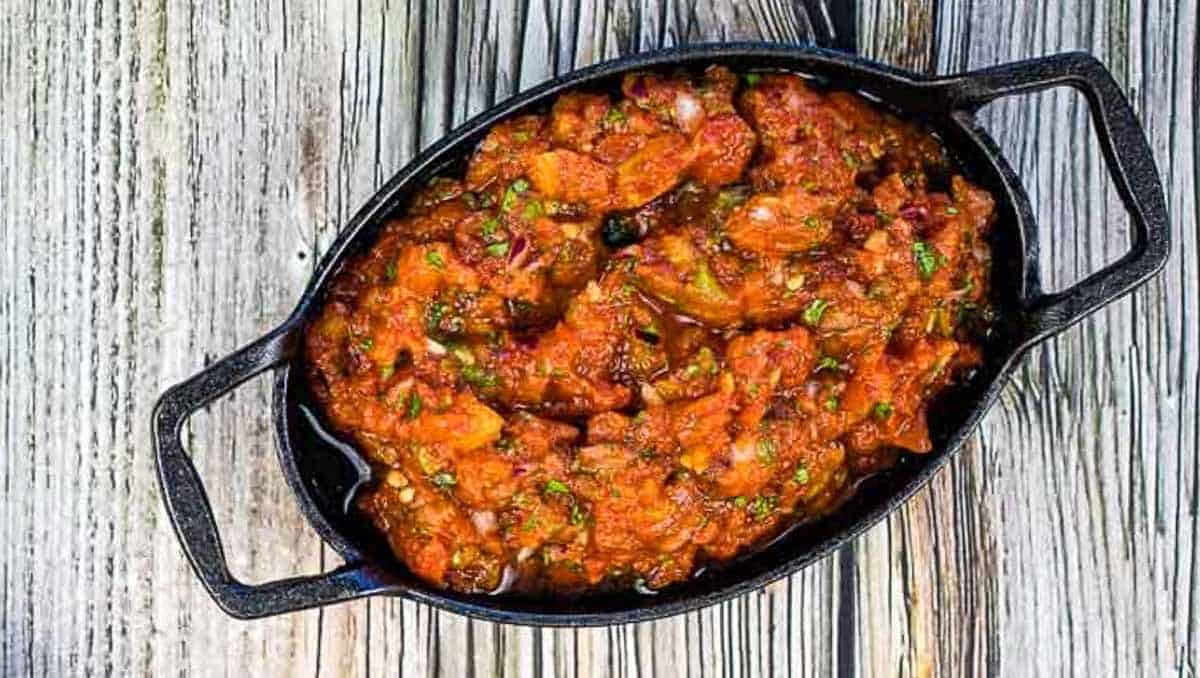 Smoked Tomato Salsa in a black dish.