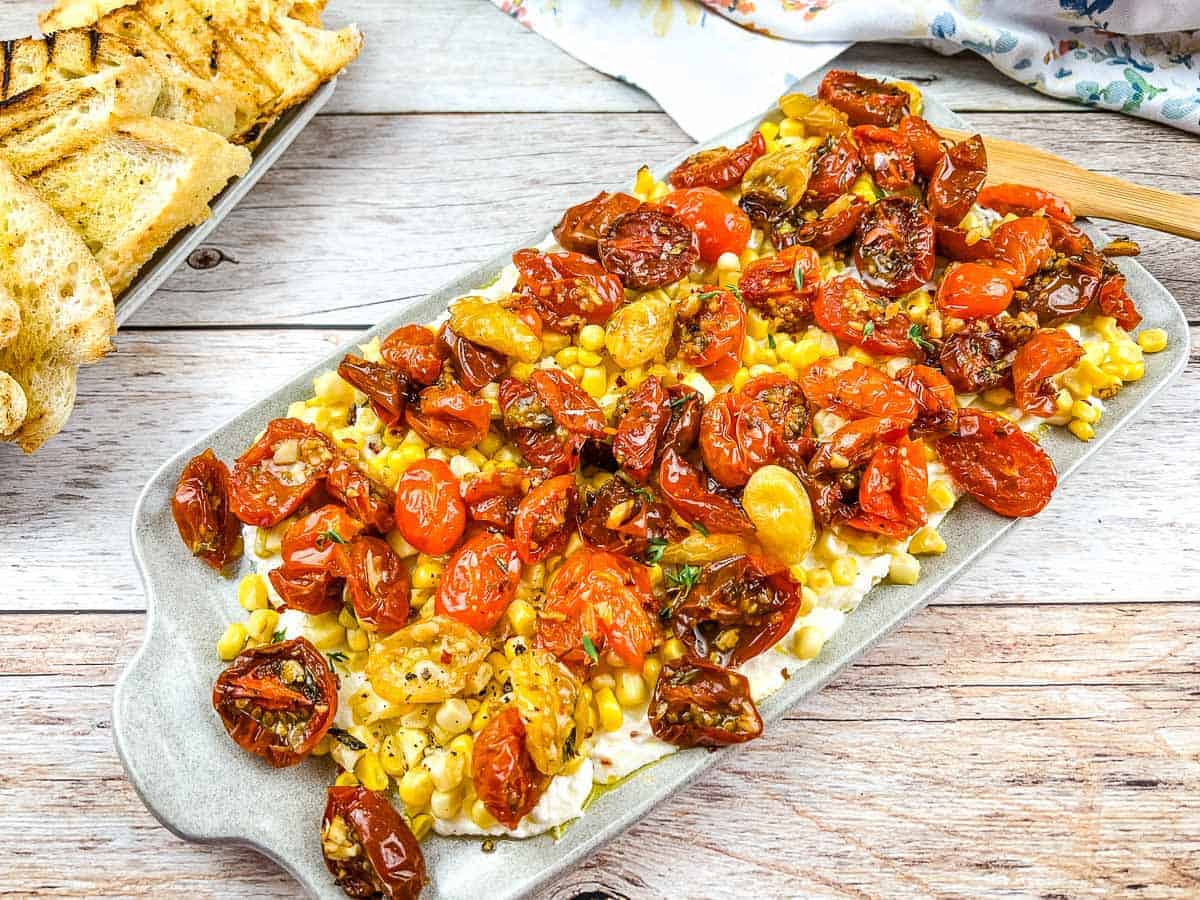 Tomato bruschetta board on a table.