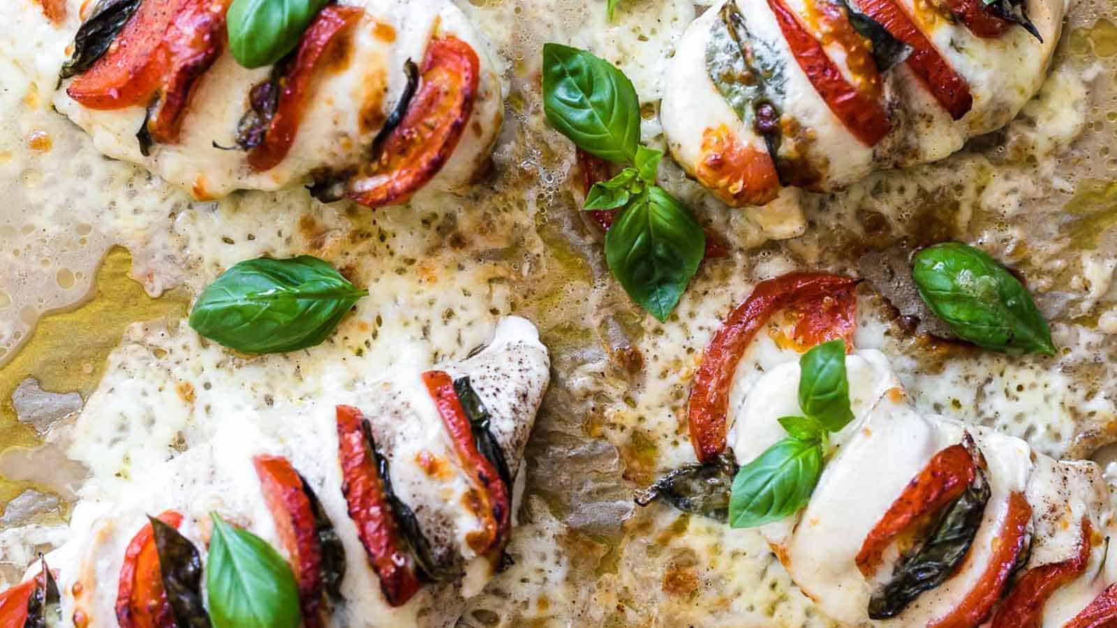 Stuffed Caprese Chicken Hasselback on a baking tray.