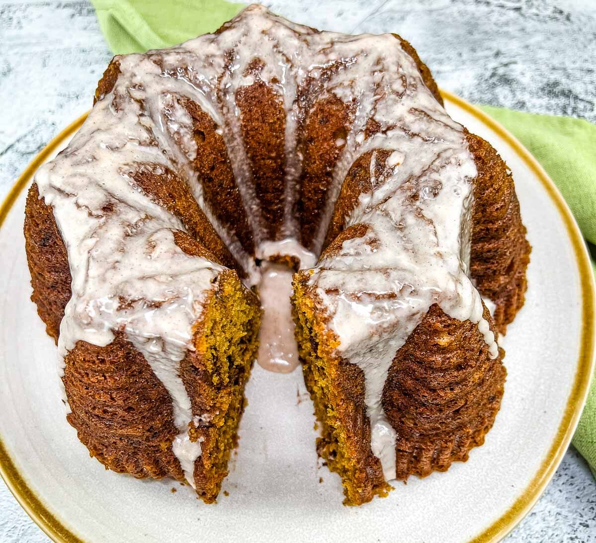 Pumpkin Chocolate Cake on a white circular plate with gold rim.